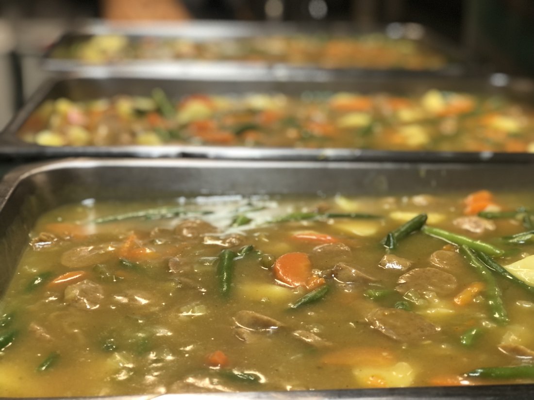 Country Heart hearty home-style stew prepared in bain-marie trays.