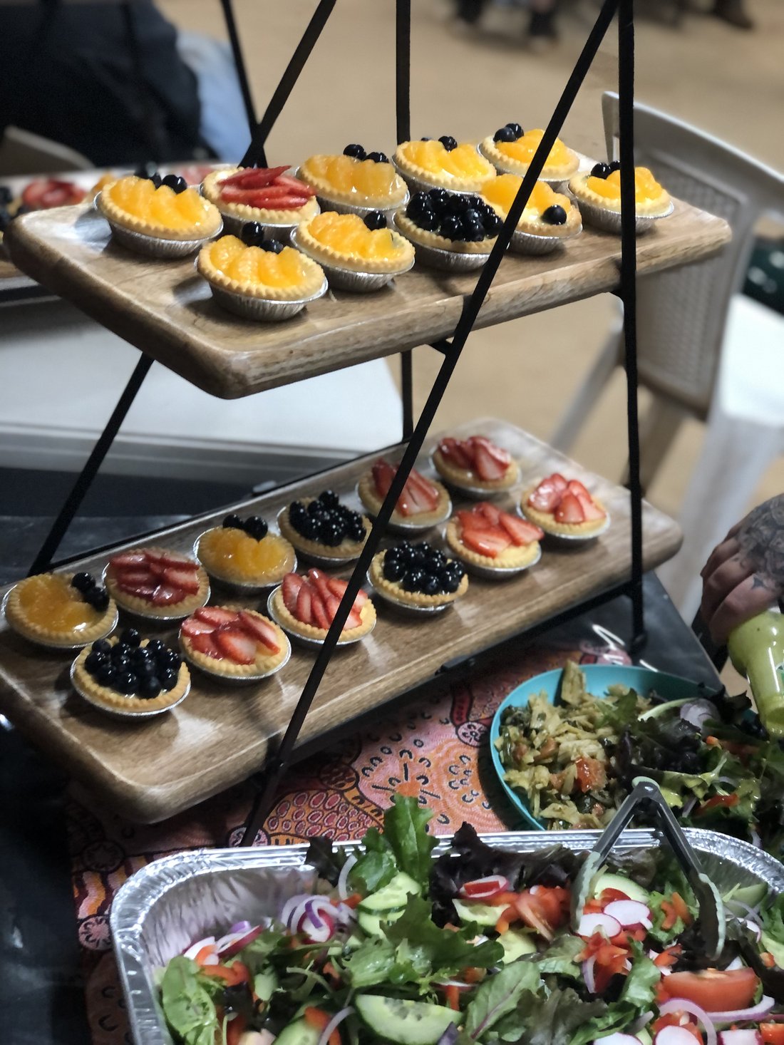 Mini fruit tarts on a tiered serving display.