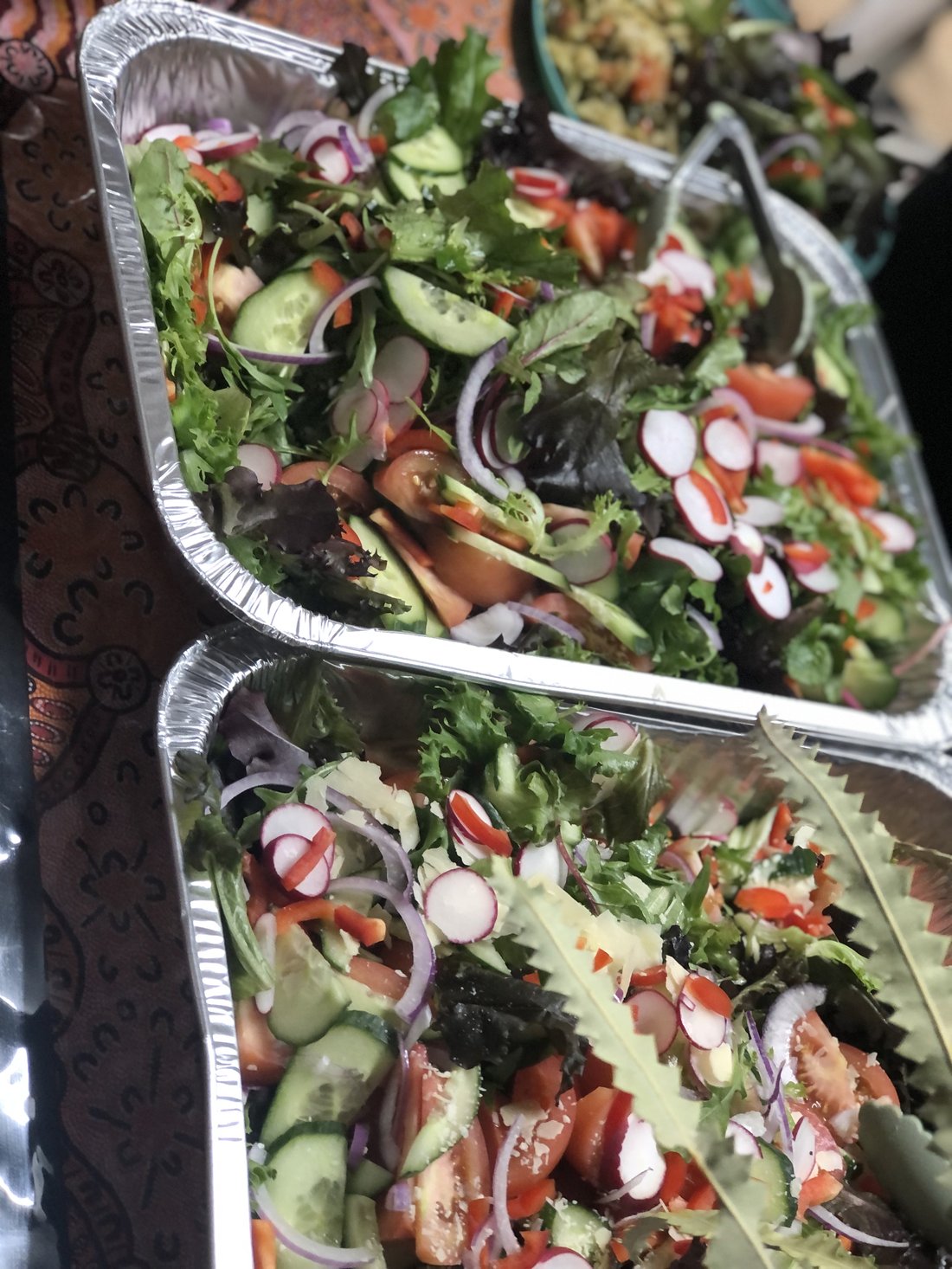 Fresh salads in catering foil trays.