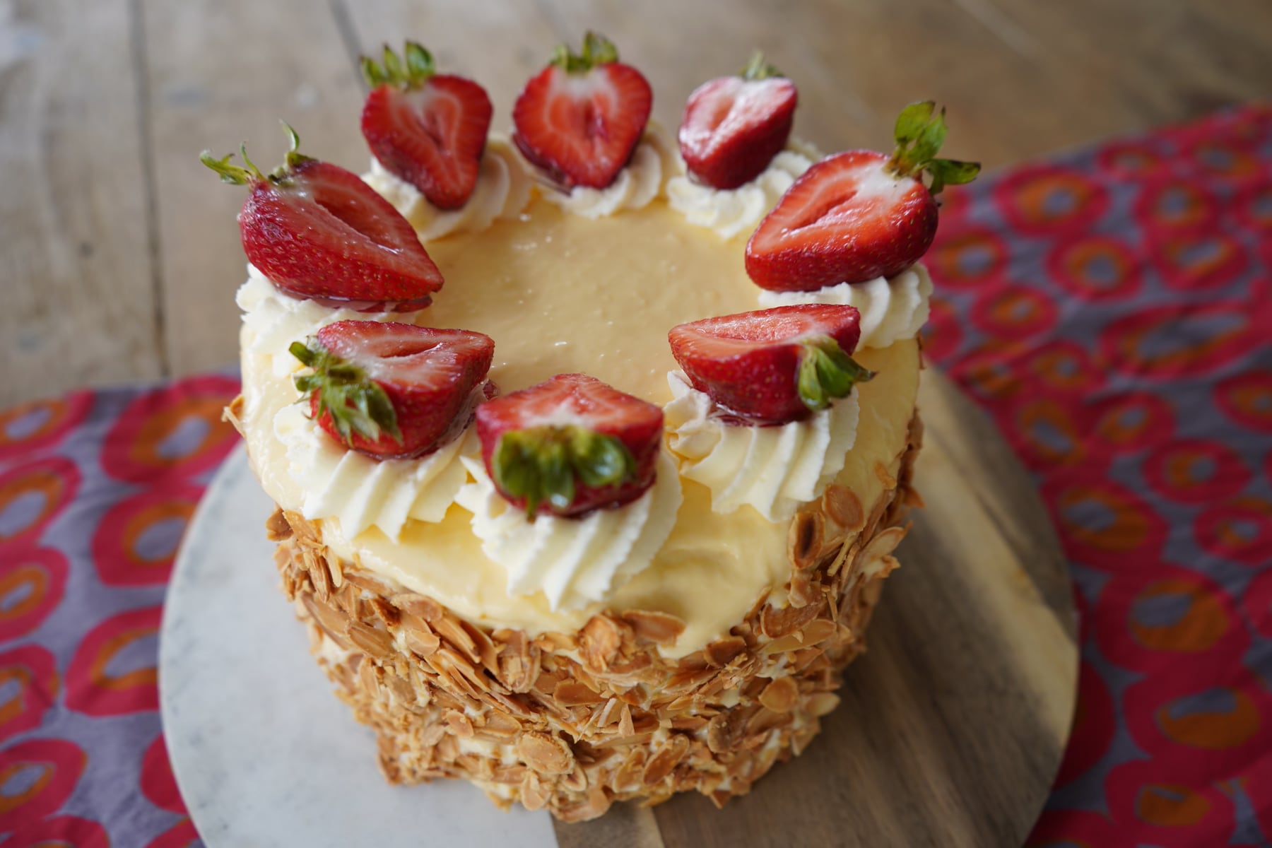Strawberry cream cake decorated with fresh strawberries.