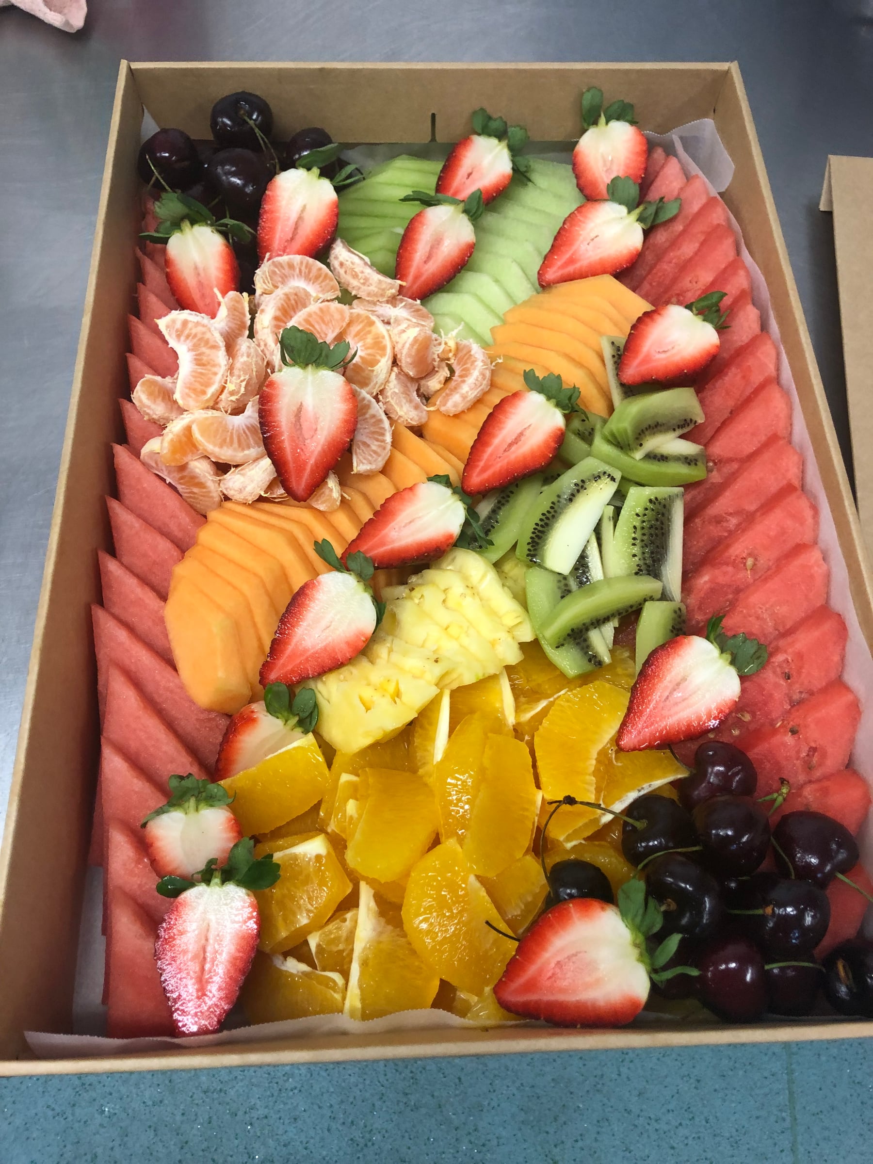 Large bowls of colourful fresh salad ready for catering.