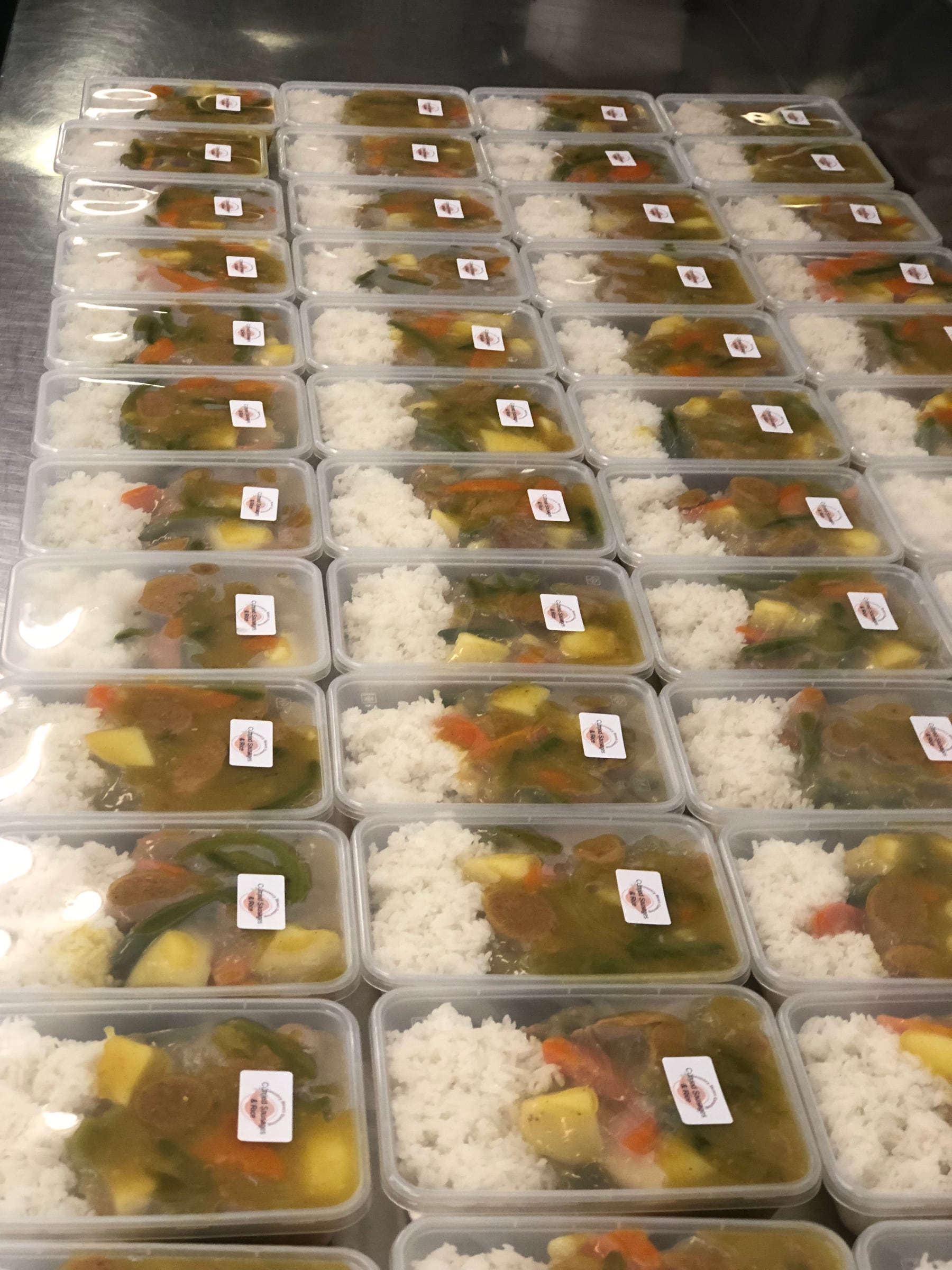 Prepared beef and mashed potato meals in takeaway containers.