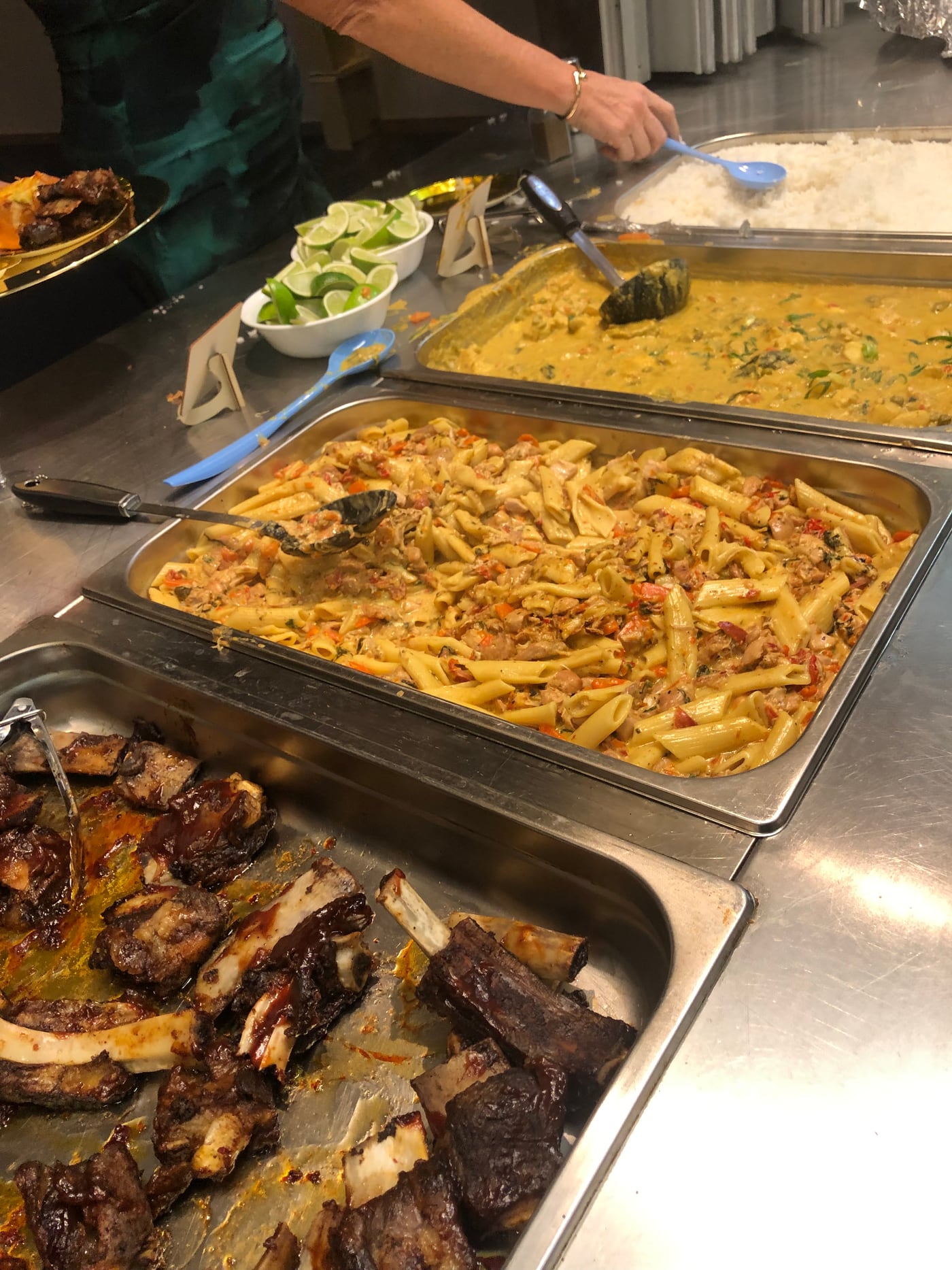 Hot buffet trays prepared for remote community and worksite meals.